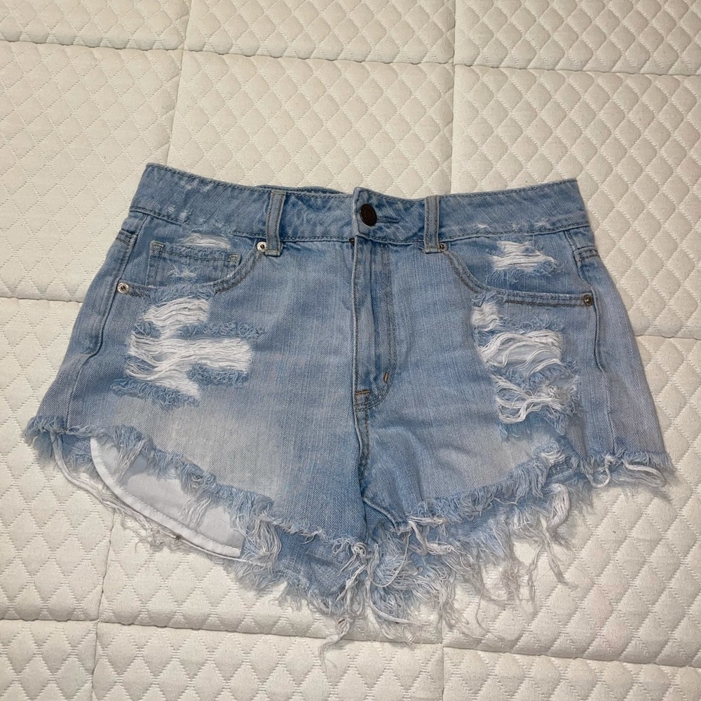 High-rise distressed denim shorts